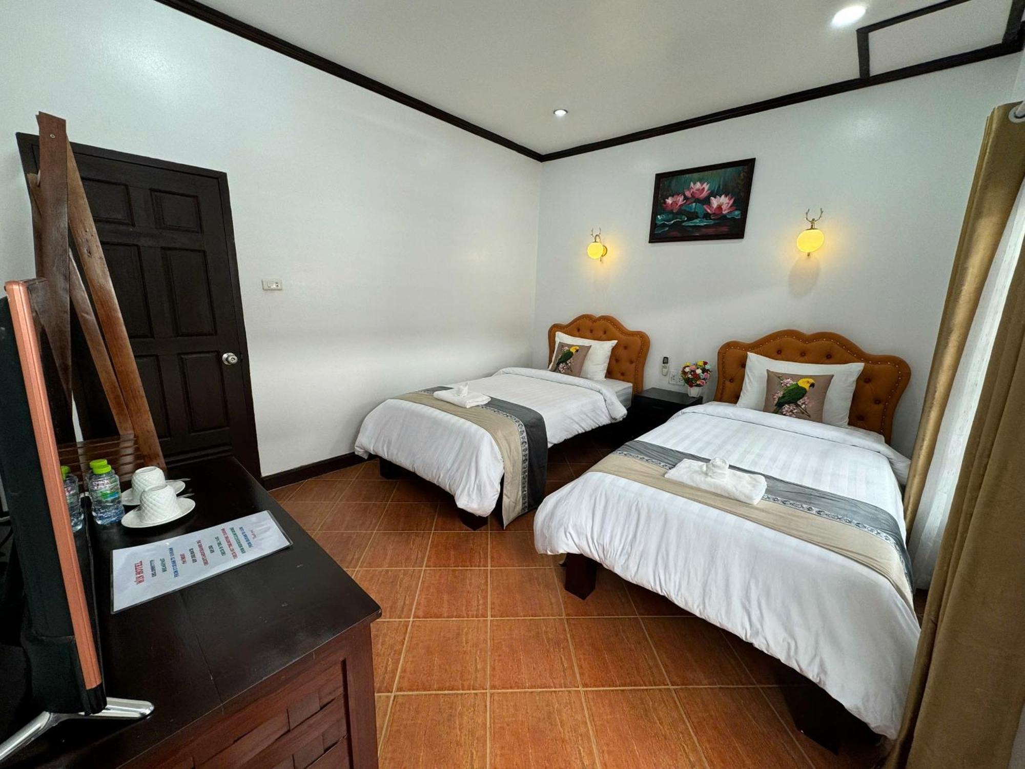 Win Hotel Vangviang Szoba fotó